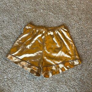Gold sleep shorts, size small, a little baggy but silky soft to the touch.